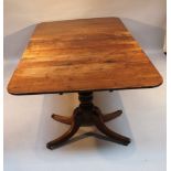 A 19thC mahogany twin pillar dining table, the rectangular top with rounded ends, raised on heavy