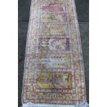 Various machine woven rugs, to include a rectangular example in geometric floral pattern in red,