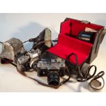 Various cameras, to include Zenit HEL IOS-44-2 lens, Minolta carrying case, 23cm high, other lens,