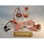 Various perfume atomizers, a pink glass powder box, amber coloured dish, 22cm wide, etc. (a