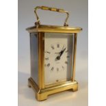 A Bayard French carriage clock, fitted in a brass case with swing handle, the 5cm chapter ring