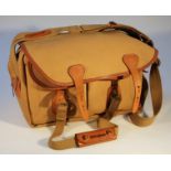 A Billingham camera bag, in khaki canvas with a fitted interior and exterior canvas straps, 30cm