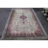 A Wilton machine woven rug, of floor standing form, geometrically decorated in blue, red and