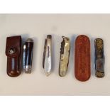 Various pen knives, to include an example with a mother of pearl handle and silver blade, another