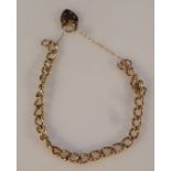 A ladies bracelet, of heavy link form, with heart shaped clasp, yellow metal, marked 375, 22cm
