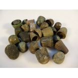 A quantity of various thimbles, to include silver plated, iron and base metal examples, another of