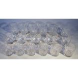 Various crystal glass tumblers, each with hobnail geometric design bodies on circular feet, 10.5cm