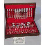 A silver plated canteen of cutlery, by Oneida, settings for six, in mahogany finish canteen, 10cm