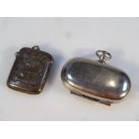 An Edwardian silver vesta case, by Spurrier & Co, of rounded form with a part engine turned