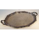 An early 20thC American silver plated tray, of shaped oval form with moulded carrying handles in the