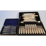 A set of six George V cased silver handled butter knives, of shell capped form, 21cm wide, and