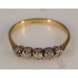 A ladies five stone diamond ring, claw set on a plain shank, yellow metal marked 18ct & plat, 2g