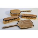 A George VI silver and enamel part dressing table set, comprising two clothes brushes, hair brush,