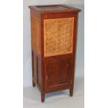 A Michael D'Soza Mufti oak cabinet, of squared form with an upper bergere panelling, with a panelled
