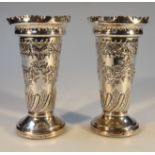 A pair of Victorian silver vases, by Jenkins & Timm, of tapering cylindrical form with flared necks