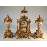 An earthenware and gilt metal clock garniture, the central clock with 9.5cm dia. dial, set with