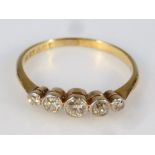 A ladies diamond ring, with old mine cut stones, on a plain shank, yellow metal marked 18ct & plat,