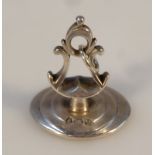 A George III silver seal, by Samuel Davenport, of shaped form with a pierced handle and oval base,