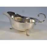 An Edwardian silver sauce boat, by Nathan & Hayes, with a flared rim, and acanthus topped 'C'