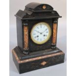 A Victorian black slate and marble mantel clock, in a classical domed case, the circular 10.5cm dia.