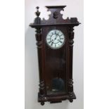 A 19thC walnut cased Vienna wall clock, the 19cm dia. dial set with Roman numerals in a three part