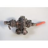 A Victorian part silver child's rattle, part repoussé decorated with outer bells and teething end,