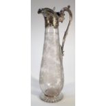 A Victorian silver glass and etched claret jug, by the Harrison Brothers, with a hinged shell scroll