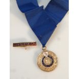 A yellow metal and part enamel Liverpool Presidential Butcher's Association Medal, awarded to W E