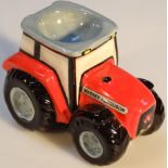 A Border Fine Arts Massey Ferguson Collection, red tractor egg cup, A1229, 8cm high.