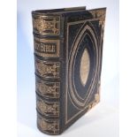 A 19thC Brown's Family Bible, with gilt metal clasps and stencilled boards, 35cm high.