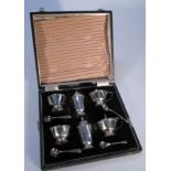 A George V harlequin silver cruet set, by Adie Brothers Ltd, comprising two mustard pots, pepper