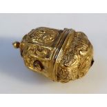 A mid-18thC gilt metal thimble case, heavily chased with scrolls and flowers, the hinged lid with