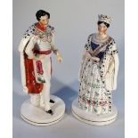 A pair of late 19thC Staffordshire figures, of Queen Victoria and Prince Albert, polychrome