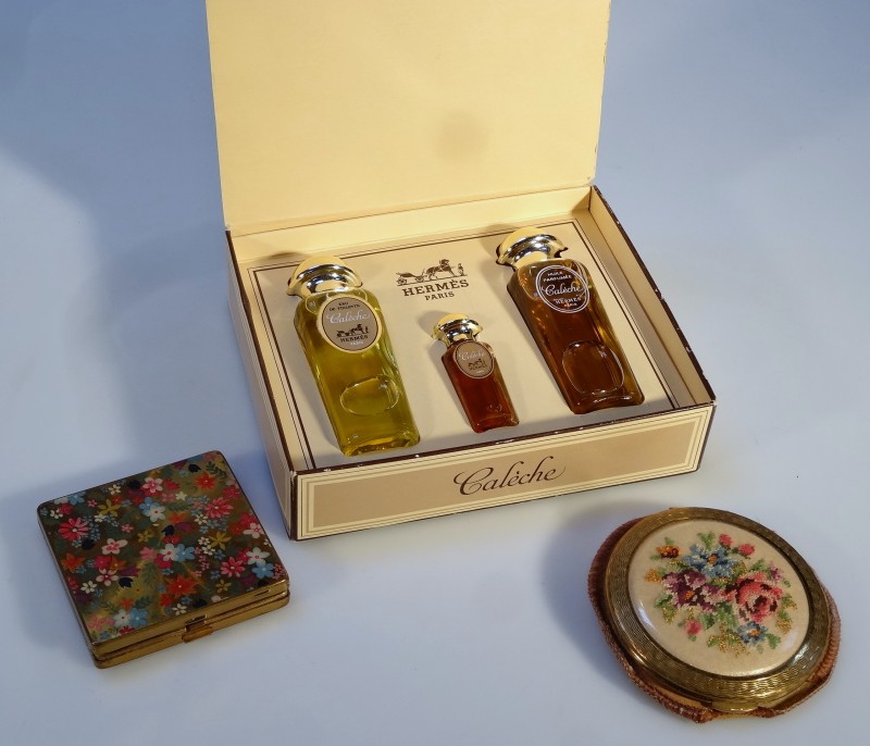 A boxed set of Hermes Caleche perfume, comprising three bottles, together with a powder compact with
