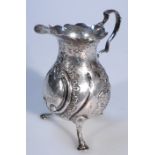 A Victorian silver cream jug, by James Deakin & Sons, the helmet body with a shaped rim and thumb