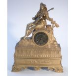 An 19thC gilt metal mantel clock, by J Charles, Paris, the 8cm Roman numeric dial surmounted by a