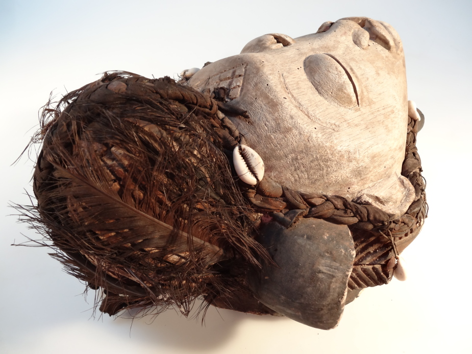 A Gabon African tribal mask, the carved wooden central face, with feathered and shell head dress, - Image 3 of 4