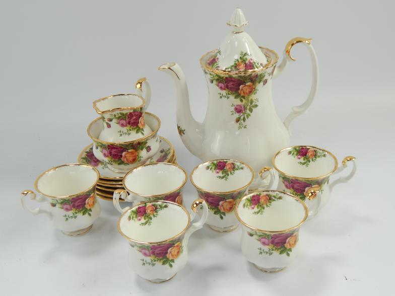 Royal Albert Country Roses coffee service, including a coffee pot, cream jug and sugar basin, six