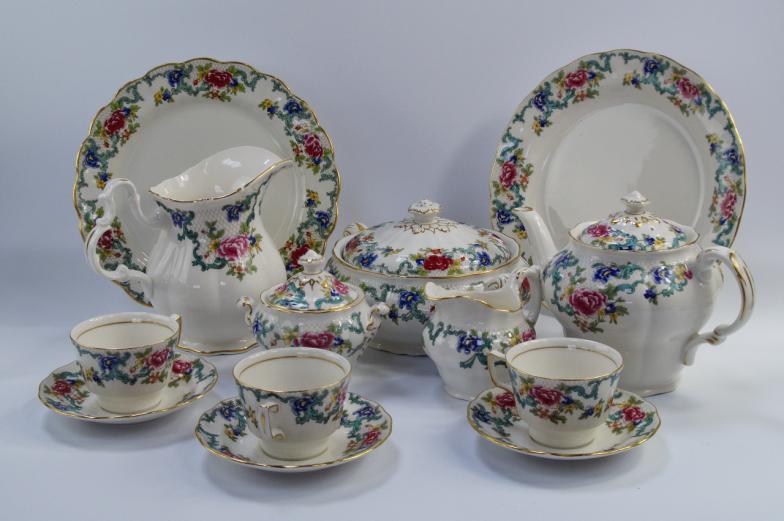 A Royal Doulton and Booths Floradora dinner and tea service, comprising serving plates, dinner