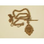 A 9ct gold double watch chain and fob, with shield crested fob, bearing initials F.S. 1915, 42.7g