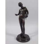 A 19thC Grand Tour type bronze figure, in the form of a nude Mercury, on a circular base, 28cm high