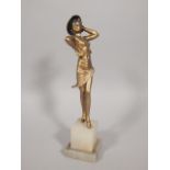 An Art Deco cold painted bronze figure of female dancer, wearing a Spanish style hat, on a stepped
