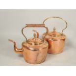 Two similar Victorian copper and brass kettles, each with an acorn style finial to the lid.