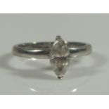 A marquise diamond solitaire ring, with central stone of 0.75 carats, white metal, marked 750, 3.