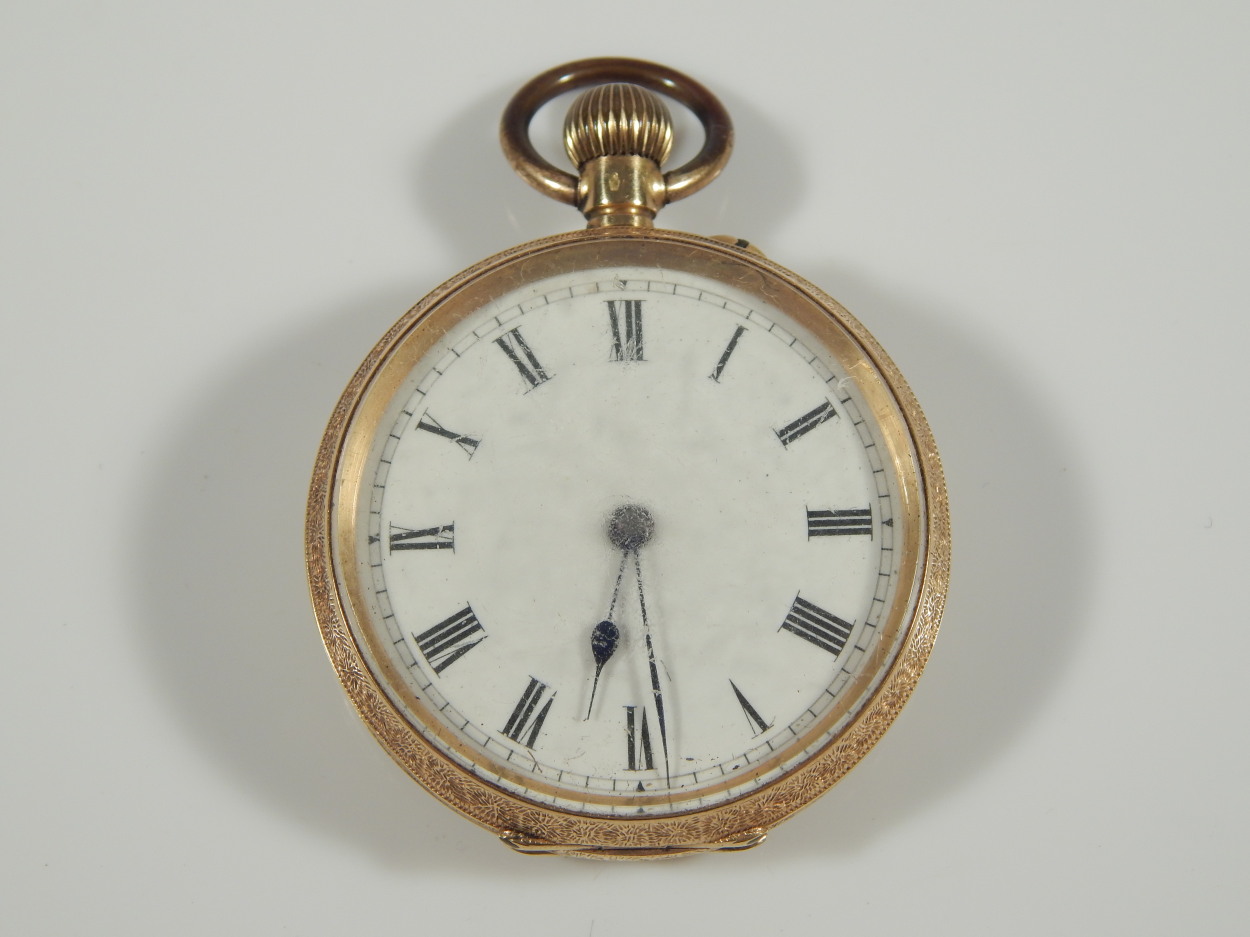 A fob watch, with white enamel dial and blue hands, bezel wind, yellow metal case, marked 18K