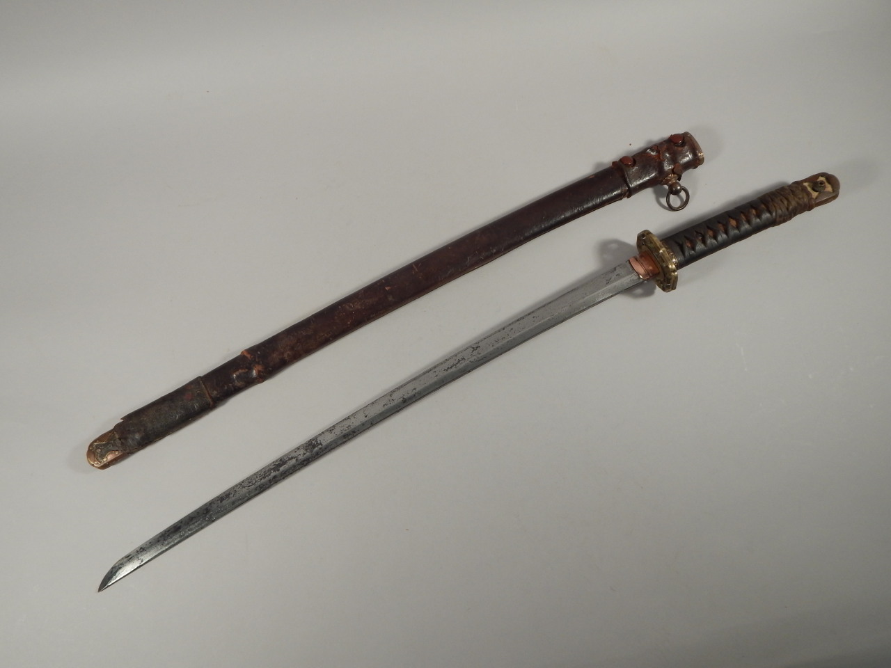 A Japanese World War II Officer's samurai sword, with bronze mounts and pierced brass tsuba, the - Image 2 of 3