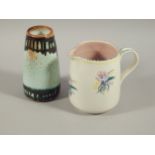 Two items of Poole pottery, to include a Poole pottery jug and vase, in treacle glaze, 18cm high