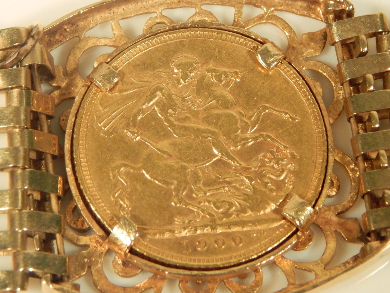 A triple sovereign bracelet, set with three full gold sovereigns, dated 1900, 1899, and 1897, with - Image 2 of 4