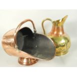 A Victorian copper coal scuttle, with swing handle and a copper and brass ewer.