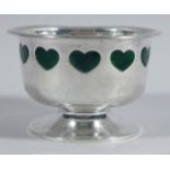 An Edwardian silver Arts & Crafts style bowl, with green enamel and hammered decoration, made by